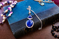 Heavy vintage sterling silver necklace featuring a large, deep blue lapis lazuli cabochon pendant with a secondary triangular lapis stone above it.